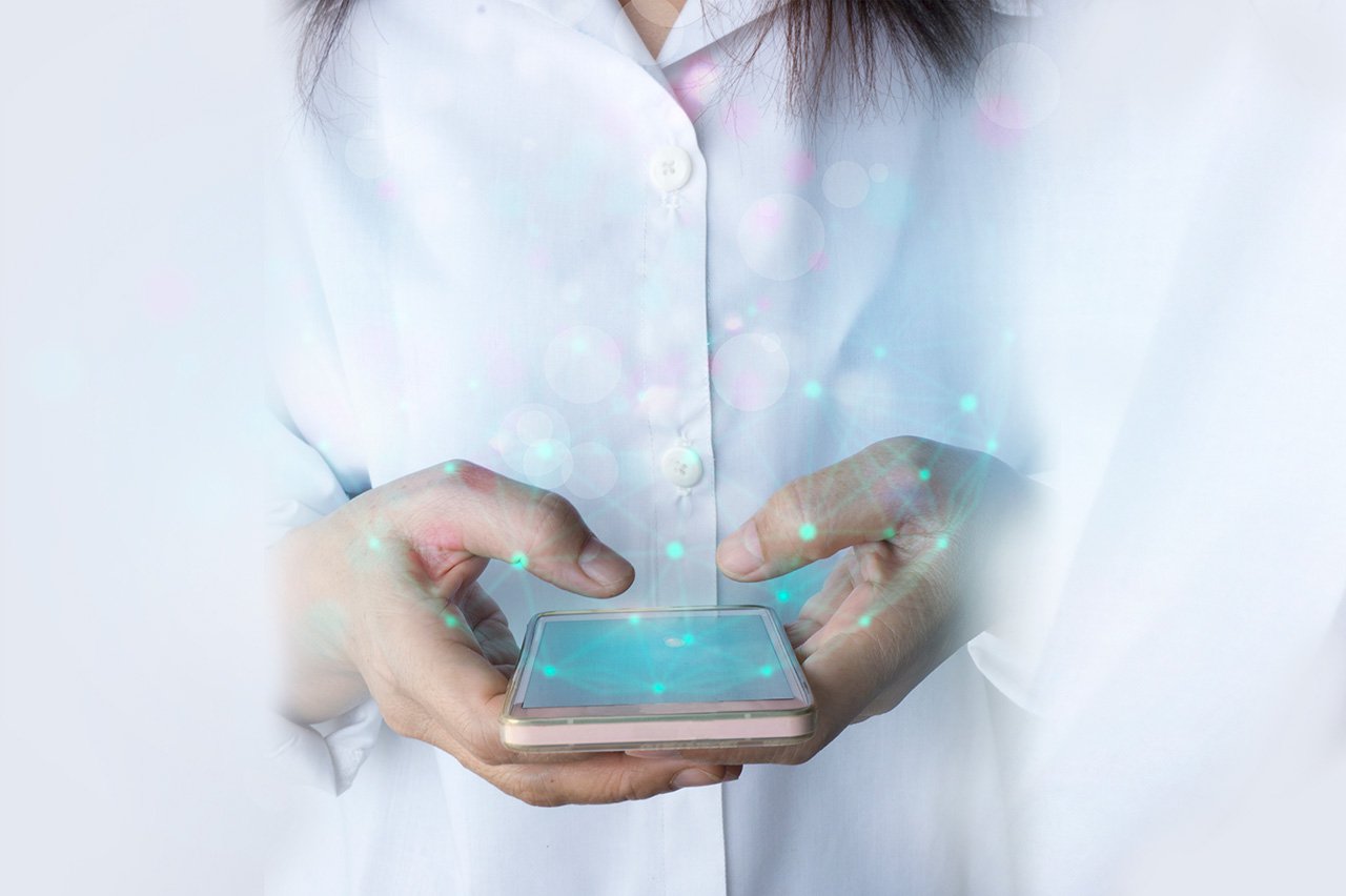 Woman hand holding mobile phone data synchronization